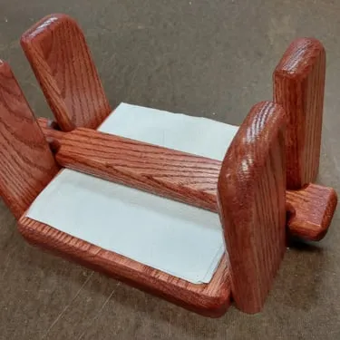 Small custom wooden piece with upright supports and a light center panel